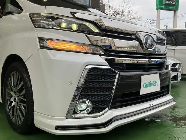 トヨタ ヴェルファイア Z Gエディション 神奈川県 2016(平28)年 8.9万km ホワイトパールクリスタルシャイン JBLサウンドシステム/純正10型ナビ/・AM/FM SD CD BT フルセグTV/レーダークルーズコントロール/nanoeオートエアコン/両側電動スライドドア/パワーバックドア/電動パーキングブレーキ/オートブレーキホールド/アラウンドビューカメラ/ETC/インテリジェントクリアランスソナー/ハーフレザーシート/助手席パワーオットマン/ステアリングヒーター/LEDヘッドライト/LEDイルミネーション/後席サンシェード/自動防眩ミラー