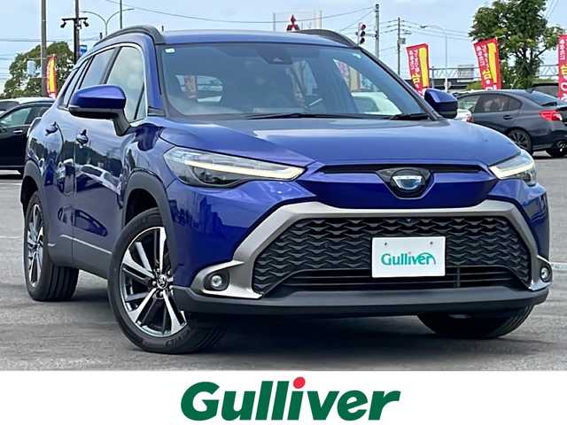 トヨタ カローラ クロス ハイブリッド Z 道央・札幌 2022(令4)年 0.9万km ダークブルーマイカM ４WD/純正ディスプレイオーディオ/AM/FM/USB/BT/トヨタセーフティセンス/プリクラッシュセーフティ/横滑り防止装置/レーダークルーズコントロール/レーンキープアシスト/クリアランスソナー/ブラインドスポットモニター/パーキングサポートブレーキ/リヤクロストラフィックアラート/ロードサインアシスト/パノラミックビューモニター/ビルトインETC/EVMODE/DRIVEMODE切替/パワーバックドア/D席パワーシート/前席シートヒーター/ハーフレザーシート/革巻きステアリング/ステアリングリモコン/電動パーキング/ブレーキホールド/自動防眩ミラー/プッシュスタート/スマートキー/LEDヘッドライト/オートライト/オートハイビーム/フォグランプ/電動格納ミラー/ヒーテッドドアミラー/ウィンカーミラー/フロアマット/レンタカー登録