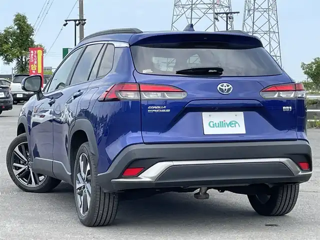 トヨタ カローラ クロス ハイブリッド Z 道央・札幌 2022(令4)年 0.9万km ダークブルーマイカM ４WD/純正ディスプレイオーディオ/AM/FM/USB/BT/トヨタセーフティセンス/プリクラッシュセーフティ/横滑り防止装置/レーダークルーズコントロール/レーンキープアシスト/クリアランスソナー/ブラインドスポットモニター/パーキングサポートブレーキ/リヤクロストラフィックアラート/ロードサインアシスト/パノラミックビューモニター/ビルトインETC/EVMODE/DRIVEMODE切替/パワーバックドア/D席パワーシート/前席シートヒーター/ハーフレザーシート/革巻きステアリング/ステアリングリモコン/電動パーキング/ブレーキホールド/自動防眩ミラー/プッシュスタート/スマートキー/LEDヘッドライト/オートライト/オートハイビーム/フォグランプ/電動格納ミラー/ヒーテッドドアミラー/ウィンカーミラー/フロアマット/レンタカー登録