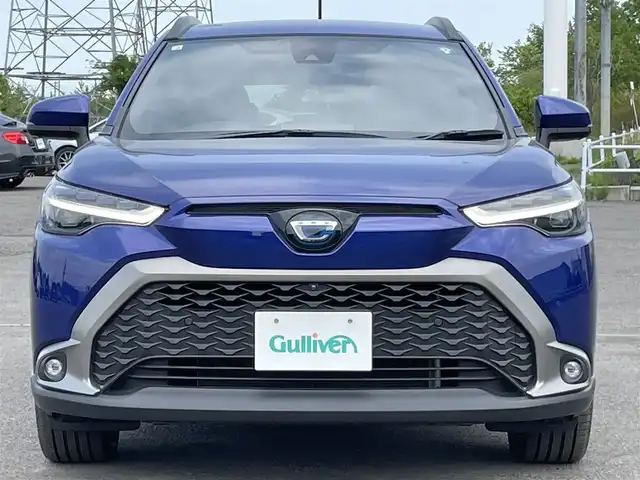 トヨタ カローラ クロス ハイブリッド Z 道央・札幌 2022(令4)年 0.9万km ダークブルーマイカM ４WD/純正ディスプレイオーディオ/AM/FM/USB/BT/トヨタセーフティセンス/プリクラッシュセーフティ/横滑り防止装置/レーダークルーズコントロール/レーンキープアシスト/クリアランスソナー/ブラインドスポットモニター/パーキングサポートブレーキ/リヤクロストラフィックアラート/ロードサインアシスト/パノラミックビューモニター/ビルトインETC/EVMODE/DRIVEMODE切替/パワーバックドア/D席パワーシート/前席シートヒーター/ハーフレザーシート/革巻きステアリング/ステアリングリモコン/電動パーキング/ブレーキホールド/自動防眩ミラー/プッシュスタート/スマートキー/LEDヘッドライト/オートライト/オートハイビーム/フォグランプ/電動格納ミラー/ヒーテッドドアミラー/ウィンカーミラー/フロアマット/レンタカー登録