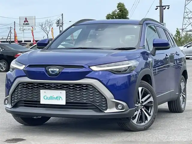 トヨタ カローラ クロス ハイブリッド Z 道央・札幌 2022(令4)年 0.9万km ダークブルーマイカM ４WD/純正ディスプレイオーディオ/AM/FM/USB/BT/トヨタセーフティセンス/プリクラッシュセーフティ/横滑り防止装置/レーダークルーズコントロール/レーンキープアシスト/クリアランスソナー/ブラインドスポットモニター/パーキングサポートブレーキ/リヤクロストラフィックアラート/ロードサインアシスト/パノラミックビューモニター/ビルトインETC/EVMODE/DRIVEMODE切替/パワーバックドア/D席パワーシート/前席シートヒーター/ハーフレザーシート/革巻きステアリング/ステアリングリモコン/電動パーキング/ブレーキホールド/自動防眩ミラー/プッシュスタート/スマートキー/LEDヘッドライト/オートライト/オートハイビーム/フォグランプ/電動格納ミラー/ヒーテッドドアミラー/ウィンカーミラー/フロアマット/レンタカー登録