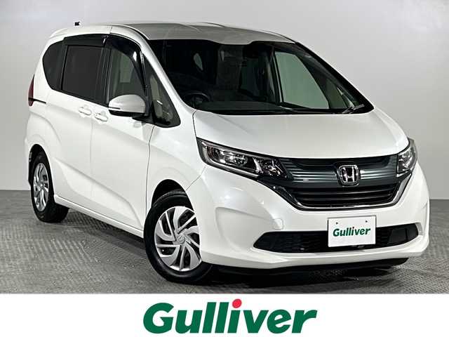 ホンダ フリード G ホンダセンシング 沖縄県 2019(平31)年 2.6万km ホワイトオーキッドパール 県外仕入れ/禁煙車/両側パワースライドドア/純正ディーラーナビ/【CD/DVD/フルセグTV/BT】/バックカメラ/ドライブレコーダー/ステアリングリモコン/ビルトインETC/ホンダセンシング/→衝突被害軽減ブレーキ/→先行者発進お知らせ機能/→レーンキープアシスト/→レーダークルーズコントロール/スマートキー/スペアキー