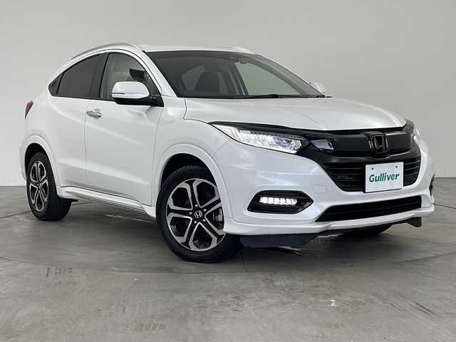 ホンダ ヴェゼル ハイブリッド Z ホンダセンシング 兵庫県 2019(平31)年 6.2万km プラチナホワイトパール ・純正９インチナビ/CD/DVD/SD/Bluetooth/TV/・バックカメラ/・社外デジタルインナーミラー/・社外前後ドライブレコーダー/・パドルシフト/・前席シートヒーター/・Honda SENSING/・衝突軽減ブレーキ〈CMBS〉/・誤発進抑制機能/・歩行者事故低減ステアリング/・路外逸脱抑制機能/・ACC〈アダプティブ・クルーズ・コントロール〉/・LKAS〈車線維持支援システム〉/・先行車発進お知らせ機能/・標識認識機能/・パドルシフト/・LEDライト/・LEDフォグランプ/・ビルトインETC2.0/・ハーフレザーシート/・スマートキー/・コンフォートビューパッケージ/・フロントワイパーデアイサー/・ドアミラーヒーター/・純正フロアマット/・17インチ純正アルミホイール/・スペアキー/・取扱説明書/・保証書