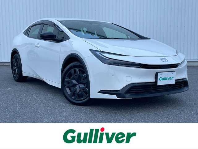 トヨタ プリウス X 滋賀県 2024(令6)年 0.2万km スーパーホワイトⅡ 社外SDナビ/(BT/AM/FM)/バックカメラ/ビルトインETC/AC１００V充電/衝突軽減ブレーキ/パーキングサポートブレーキ/盗難防止装置/ブラインドスポットモニター/クリアランスソナー/追従クルーズコントロール/レーンキープアシスト/LEDヘッドライト/オートマチックハイビーム/ドライブレコーダー/スペアキー