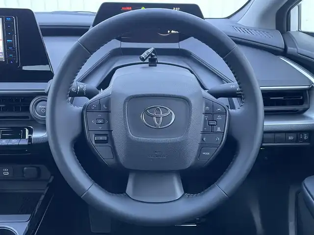 トヨタ プリウス X 滋賀県 2024(令6)年 0.2万km スーパーホワイトⅡ 社外SDナビ/(BT/AM/FM)/バックカメラ/ビルトインETC/AC１００V充電/衝突軽減ブレーキ/パーキングサポートブレーキ/盗難防止装置/ブラインドスポットモニター/クリアランスソナー/追従クルーズコントロール/レーンキープアシスト/LEDヘッドライト/オートマチックハイビーム/ドライブレコーダー/スペアキー