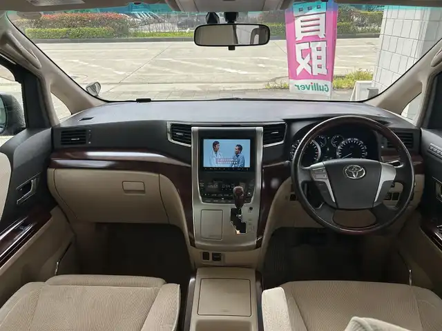 トヨタ アルファード 350G 愛知県 2008(平20)年 8.7万km ゴールドパールクリスタルシャイン 純正HDDナビ/フルセグTV・CD・DVD・SD・Bluetooth/純正フリップダウンモニター/両側パワースライドア/前席パワーシート/運転席メモリー機能付きパワーシート/ウッドコンビステアリング/助手席・二列目オットマン/クルーズコントロール（追従無し）/コーナーセンサー/ステアリングスイッチ/ビルトインETC/HIDヘッドライト(オートライト)/フォグランプ/スマートキー/プッシュスタート/横滑り防止/純正フロアマット/純正ドアバイザー/保証書