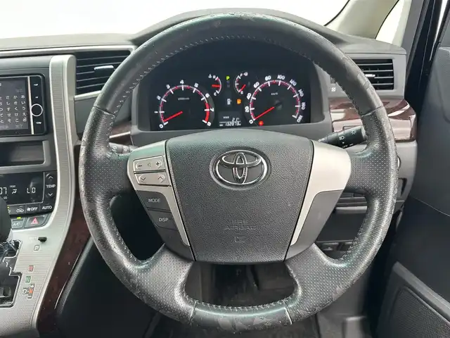 トヨタ ヴェルファイア 2．4Z 道北・旭川 2013(平25)年 13.3万km ボルドーマイカメタリック (株)IDOMが運営する【じしゃロン旭川店】の自社ローン専用車両になります。こちらは現金またはオートローンご利用時の価格です。自社ローンご希望の方は別途その旨お申付け下さい/　/・純正ナビ/・ETC/・片側パワースライドドア/・フリップダウン/・スマートキー1個/・取扱説明書