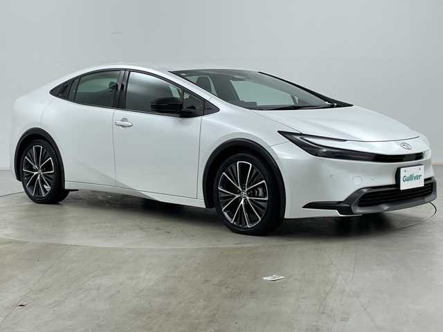 トヨタ プリウス Z 道央・札幌 2023(令5)年 1.5万km プラチナホワイトパールマイカ ・純正１２型コネクティッドナビ　/・パノラミックビューモニター　/・フルセグTV/・パワーバックドア/・ＡＣ１００Ｖアクセサリコンセント　/・パークアシスト　/・BSM/・プリクラッシュセーフティ　/・レーンキープアシスト/・オートハイビーム/・LEDヘッドライト/・リアフォグランプ/・ワイヤレス充電器　/・アダプティブクルーズコントロール　/・ワイパーデアイサー/・ステアリングヒーター/・ステアリングリモコン/・前席シートヒーター/シートベンチレーション/・メモリ機能付パワーシート/・ETC2.0/・19インチ純正アルミホイール/・保証書