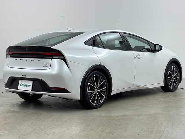トヨタ プリウス Z 道央・札幌 2023(令5)年 1.5万km プラチナホワイトパールマイカ ・純正１２型コネクティッドナビ　/・パノラミックビューモニター　/・フルセグTV/・パワーバックドア/・ＡＣ１００Ｖアクセサリコンセント　/・パークアシスト　/・BSM/・プリクラッシュセーフティ　/・レーンキープアシスト/・オートハイビーム/・LEDヘッドライト/・リアフォグランプ/・ワイヤレス充電器　/・アダプティブクルーズコントロール　/・ワイパーデアイサー/・ステアリングヒーター/・ステアリングリモコン/・前席シートヒーター/シートベンチレーション/・メモリ機能付パワーシート/・ETC2.0/・19インチ純正アルミホイール/・保証書
