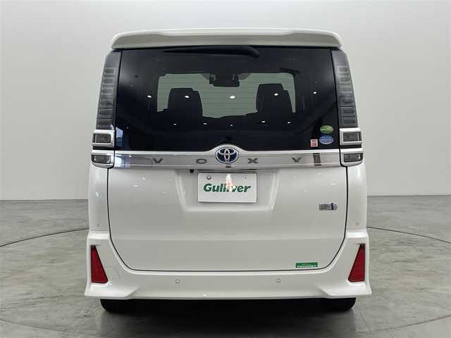 トヨタ ヴォクシー ハイブリッド ZS 煌Ⅲ 福岡県 2021(令3)年 7.1万km ホワイトパールクリスタルシャイン 純正１２．１型後席モニター　/純正１０型ナビ　/フルセグTV　/バックカメラ　/ビルトインＥＴＣ２．０　/前方ドライブレコーダー　/クルーズコントロール　/コーナーセンサー　/衝突被害軽減ブレーキ　/レーンキープ　/ＰＫＳＢ　/先行車発進お知らせ　/オートマチックハイビーム　/ハーフレザーシート　/シートヒーター　/両側電動スライドドア　/Wエアコン　/純正16インチアルミホイール