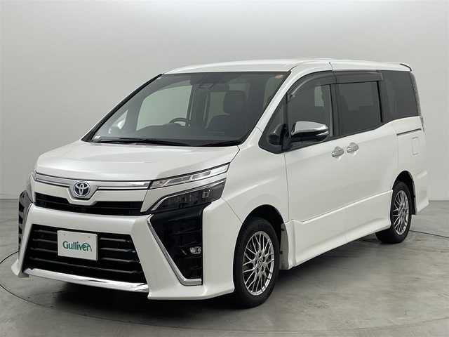 トヨタ ヴォクシー ハイブリッド ZS 煌Ⅲ 福岡県 2021(令3)年 7.1万km ホワイトパールクリスタルシャイン 純正１２．１型後席モニター　/純正１０型ナビ　/フルセグTV　/バックカメラ　/ビルトインＥＴＣ２．０　/前方ドライブレコーダー　/クルーズコントロール　/コーナーセンサー　/衝突被害軽減ブレーキ　/レーンキープ　/ＰＫＳＢ　/先行車発進お知らせ　/オートマチックハイビーム　/ハーフレザーシート　/シートヒーター　/両側電動スライドドア　/Wエアコン　/純正16インチアルミホイール
