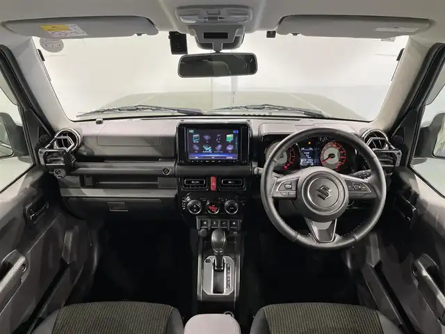 スズキ ジムニー シエラ JC 愛知県 2019(平31)年 2.1万km ジャングルグリーン 純正8インチナビ（CN-RZ846）/衝突軽減ブレーキ/ビルトインETC/シートヒーター/LEDヘッドライト/バックカメラ/クルーズコントロール/ドライブレコーダー/フルセグTV/Bluetooth/レーンキープアシスト/オートハイビーム/ダウンヒルアシスト/プッシュスタート/スマートキー/CD/DVD再生/ミュージックサーバー/純正フロアマット/純正アルミホイール/オートライト/電格ミラー/ドアバイザー/ヒーテッドドアミラー/背面タイヤ純正ハードカバー/フロントアンダーガード/サイドシルガード/4WD/トランスファーレバー/ウィンカーミラー/フォグランプ/ヘッドライトウォッシャー/横滑り防止装置/ステアリングリモコン/オートエアコン/