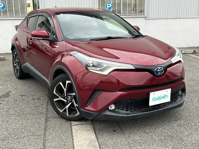 トヨタ Ｃ－ＨＲ G 富山県 2018(平30)年 10.2万km センシュアルレッドマイカ スマートキー×２/ハーフレザーシート/衝突軽減ブレーキ/純正メモリーナビ/フルセグTV/DVD/Bluetooth/ビルトETC2.0/バックカメラ/ACC/前席シートヒーター/LEDヘッドライト/フォグランプ/純正18インチAW/純正フロアマット/純正ドアバイザー/横滑り防止装置/BSM/オートハイビーム/電動格納ウィンカーミラー/電動パーキング/車線逸脱防止支援システム/スタッドレスタイヤ社外AW積込（215/60R17）
