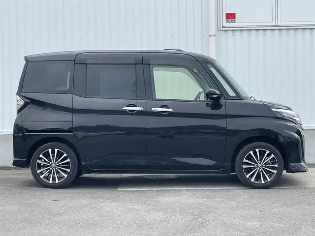 トヨタ ルーミー カスタムG－T 愛媛県 2021(令3)年 3.1万km ブラックマイカメタリック 両側パワースライドドア/パノラミックビューモニター/純正9インチナビ(Bluetooth/CD/DVD)/フルセグテレビ/ETC/レーダークルーズコントロール/アイドリングストップ/レーンキープアシスト/前後コーナーセンサー/LEDヘッドライト/オートライト/純正フロアマット/純正ドアバイザー/純正アルミホイール/横滑り防止装置/スマートキー/プッシュスタート/ABS