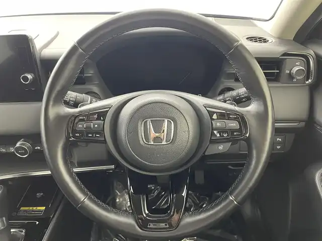 ホンダ ヴェゼル ハイブリッド e:HEV Z 愛媛県 2023(令5)年 1.8万km クリスタルブラックパール 純正９インチナビ　Ｂｌｕｅｔｏｏｔｈ　バックカメラ　レーダークルーズコントロールシートヒーター　ブラインドスポットモニター　ハーフレザーシート　ダウンヒルアシストコントロール　置くだけ充電　ETC