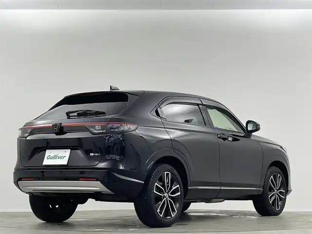 ホンダ ヴェゼル ハイブリッド e:HEV Z 愛媛県 2023(令5)年 1.8万km クリスタルブラックパール 純正９インチナビ　Ｂｌｕｅｔｏｏｔｈ　バックカメラ　レーダークルーズコントロールシートヒーター　ブラインドスポットモニター　ハーフレザーシート　ダウンヒルアシストコントロール　置くだけ充電　ETC