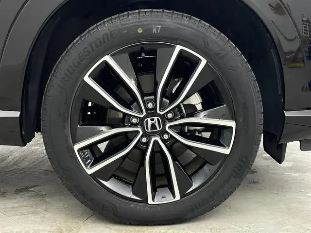 ホンダ ヴェゼル ハイブリッド e:HEV Z 愛媛県 2023(令5)年 1.8万km クリスタルブラックパール 純正９インチナビ　Ｂｌｕｅｔｏｏｔｈ　バックカメラ　レーダークルーズコントロールシートヒーター　ブラインドスポットモニター　ハーフレザーシート　ダウンヒルアシストコントロール　置くだけ充電　ETC