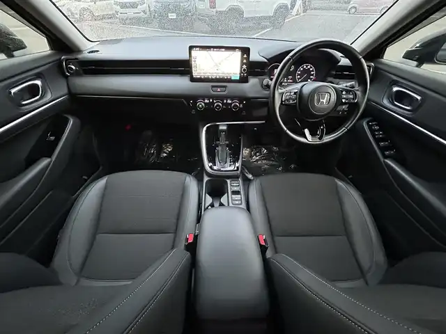 ホンダ ヴェゼル ハイブリッド e:HEV Z 愛媛県 2023(令5)年 1.8万km クリスタルブラックパール 純正９インチナビ　/Ｂｌｕｅｔｏｏｔｈ　/バックカメラ　/レーダークルーズコントロールシートヒーター　/ブラインドスポットモニター　/ハーフレザーシート　/ダウンヒルアシストコントロール　/置くだけ充電　/ETC