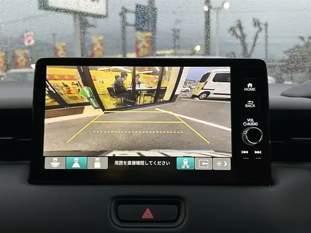 ホンダ ヴェゼル ハイブリッド e:HEV Z 愛媛県 2023(令5)年 1.8万km クリスタルブラックパール 純正９インチナビ　/Ｂｌｕｅｔｏｏｔｈ　/バックカメラ　/レーダークルーズコントロールシートヒーター　/ブラインドスポットモニター　/ハーフレザーシート　/ダウンヒルアシストコントロール　/置くだけ充電　/ETC