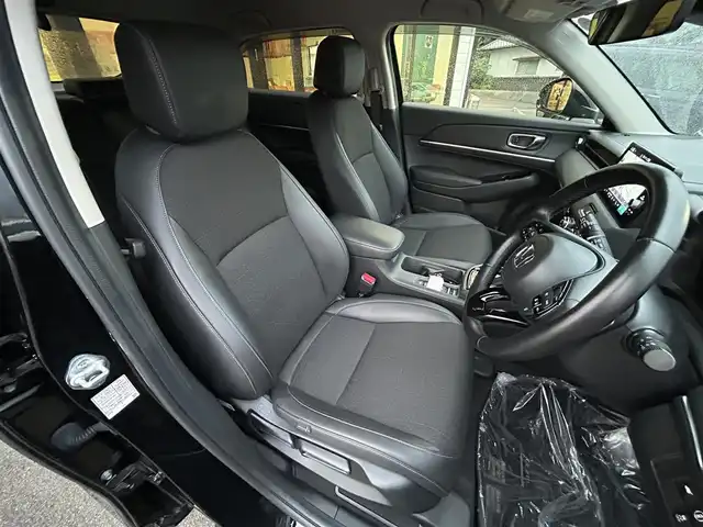 ホンダ ヴェゼル ハイブリッド e:HEV Z 愛媛県 2023(令5)年 1.8万km クリスタルブラックパール 純正９インチナビ　/Ｂｌｕｅｔｏｏｔｈ　/バックカメラ　/レーダークルーズコントロールシートヒーター　/ブラインドスポットモニター　/ハーフレザーシート　/ダウンヒルアシストコントロール　/置くだけ充電　/ETC