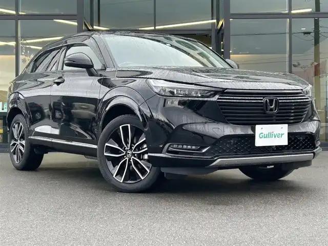 ホンダ ヴェゼル ハイブリッド e:HEV Z 愛媛県 2023(令5)年 1.8万km クリスタルブラックパール 純正９インチナビ　/Ｂｌｕｅｔｏｏｔｈ　/バックカメラ　/レーダークルーズコントロールシートヒーター　/ブラインドスポットモニター　/ハーフレザーシート　/ダウンヒルアシストコントロール　/置くだけ充電　/ETC