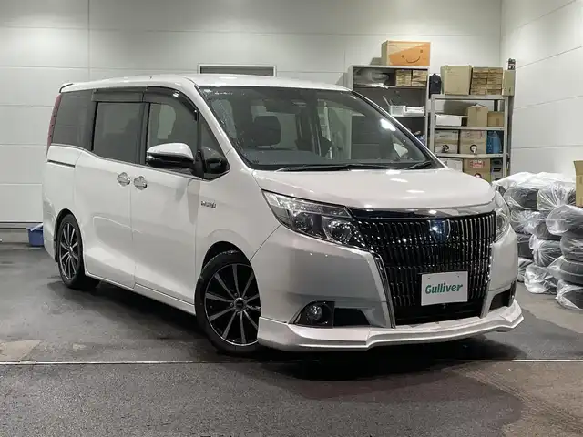 トヨタ エスクァイア ハイブリッド Gi 福島県 2016(平28)年 12.1万km ホワイトパールクリスタルシャイン ワンオーナー/アルパイン11インチナビ/CD/DVD/SD/BT/フルセグTV/アルパインフリップダウンモニター/社外17インチAW(社外AW＋冬タイヤ積込)/社外車高調ローダウン/社外フロントスポイラー/Toyota Safety Sense C/両側パワースライドドア/クルーズコントロール/合成皮革シート/シートヒーター/バックカメラ/オートハイビーム/LEDヘッドライト/ビルトインETC/プッシュスタート/ドアバイザー/フロアマット