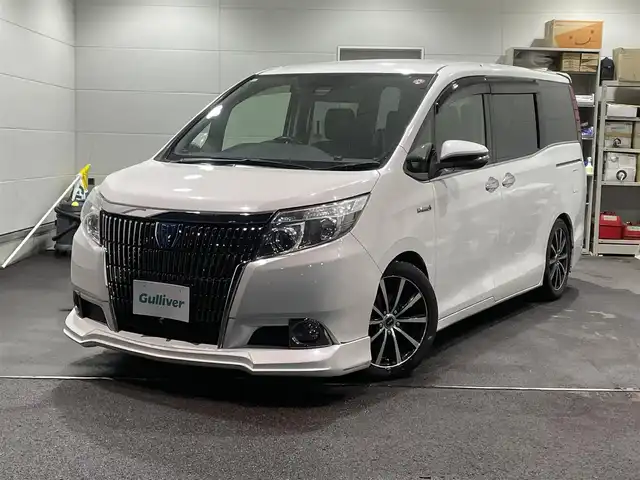 トヨタ エスクァイア ハイブリッド Gi 福島県 2016(平28)年 12.1万km ホワイトパールクリスタルシャイン ワンオーナー/アルパイン11インチナビ/CD/DVD/SD/BT/フルセグTV/アルパインフリップダウンモニター/社外17インチAW(社外AW＋冬タイヤ積込)/社外車高調ローダウン/社外フロントスポイラー/Toyota Safety Sense C/両側パワースライドドア/クルーズコントロール/合成皮革シート/シートヒーター/バックカメラ/オートハイビーム/LEDヘッドライト/ビルトインETC/プッシュスタート/ドアバイザー/フロアマット