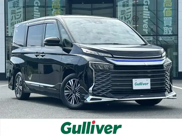トヨタ ヴォクシー ハイブリッド S－G 岡山県 2022(令4)年 2万km アティチュードブラックマイカ モデリスタフルエアロ/モデリスタッグネチャーイルミブレード/モデリスタ16インチホイール/純正10.5インチディスプレイオーティオ/(AM.FM.BT.TV.CarPlay)/ロックカメラ/トヨタセーフティセンス/・レーダークルーズコントロール/・レーンティーチャアラート/・ブリクラッシュセーフティ/・オートマチックハイビーム/両側バワースライドドア/USB/Typec/HDMI入力端子/ビルトインETC2.0/前後ドライブレコーヒー
