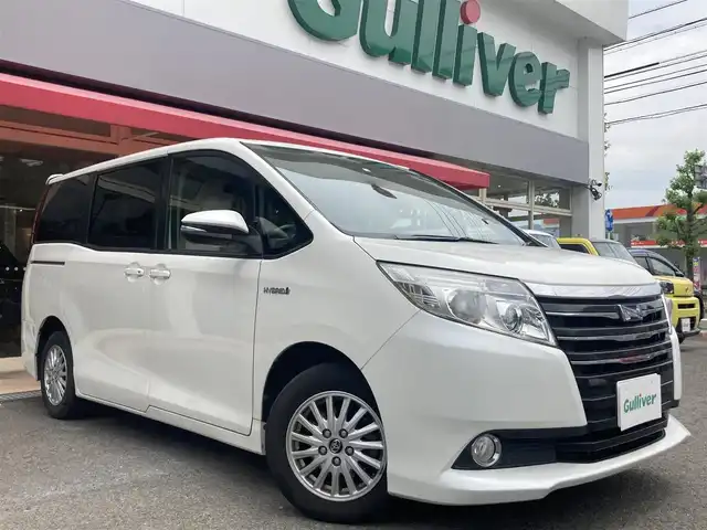 トヨタ ノア ハイブリッド G 長崎県 2014(平26)年 14.9万km ホワイトパールクリスタルシャイン 両側パワースライドドア/ディーラーOP/SDナビ【NSZT-Y62G】/Bluetooth接続/フルセグTV/DVD再生/バックカメラ/ETC/シートヒーター/ステアリングスイッチ/ベージュシート/クルーズコントロール/横すべり防止装置/後席サンシェード