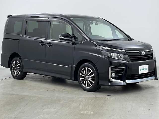 トヨタ ヴォクシー ZS 道央・札幌 2014(平26)年 7.8万km ブラック ・4WD/・寒冷地仕様/・ワンオーナー/・ALPINE9インチナビ&CD&DVD&SD&BT&TV/・両側パワースライドドア/・ドアミラーヒーター/・純正エンジンスターター付スマートキー/・社外前後ドライブレコーダー/・ステアリングスイッチ/・LEDヘッドライト/・オートライト/・純正16インチAW