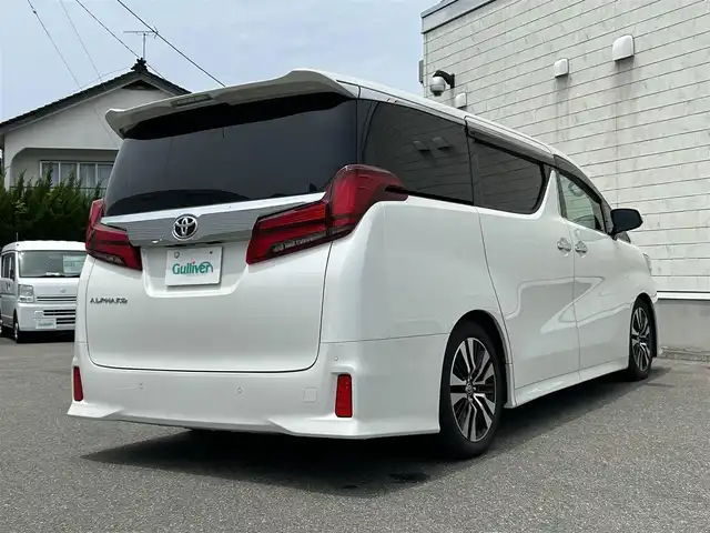 トヨタ アルファード S Cパッケージ 山形県 2020(令2)年 6.6万km ホワイトパールクリスタルシャイン 純正10インチナビ/FM/AM/DVD/CD/USB/純正フリップダウンモニター/プリクラッシュセーフティー/レーントレーシングアシスト/パーキングサポートブレーキ/TEIN車高調/ロードサインアシスト/オートハイビーム/レーダークルーズコントロール/バックカメラ/ビルトインETC2.0/前席パワーシート/前席シートヒーター /前席シートベンチレーション/運転席シートメモリー/ステアリングヒーター/ドライブレコーダー/両側パワースライドドア /パワーバックドア/100V充電/電動パーキングブレーキ/ブレーキホールド/スペアキー/保証書