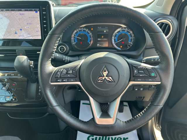 三菱 ｅＫクロス G プレミアム 石川県 2024(令6)年 0.3万km チタニウムグレーメタリック 純正９インチメモリナビ/Bluetooth/フルセグTV/MIパイロット/全方位カメラ/シートヒーター /ステアリングヒーター/４WD/デジタルインナーミラー/ワンオーナー/前後コーナーセンサー /純正１５インチアルミ/オートライト/LEDヘッドライト/踏み間違い防止