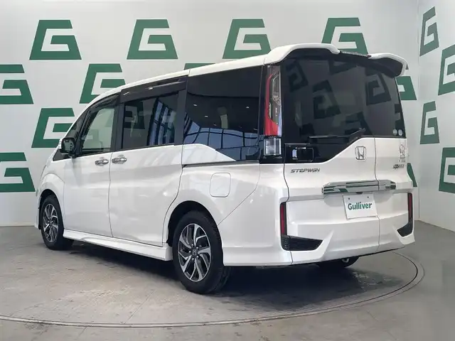 ホンダ ステップワゴン スパーダ 鹿児島県 2015(平27)年 6.6万km ホワイトオーキッドパール 禁煙車/社外ナビ【AVIC-RZ09】/（Bluetooth/フルセグTV）/社外フリップダウンモニター/バックモニター/ホンダセンシング/・衝突軽減ブレーキ/・アダプティブクルーズコントロール/・車線維持支援システム/・路外逸脱抑制機能/・誤発信抑制機能/・先行車発進お知らせ機能/・標識認識機能/両側パワースライドドア/前後ドライブレコーダー