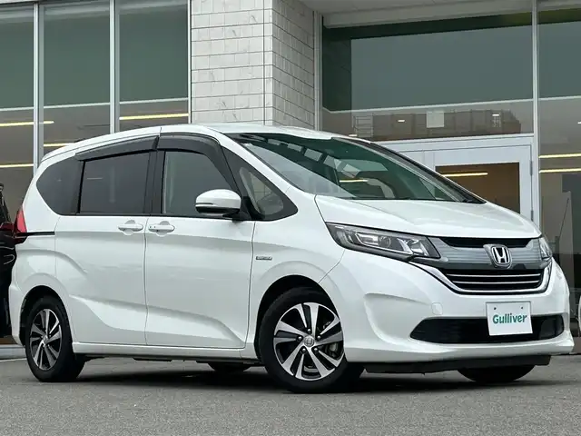 ホンダ フリード ハイブリット EX 兵庫県 2018(平30)年 5.2万km ホワイトオーキッドパール 純正9インチナビ/両側パワースライドドア/Bluetooth接続/フルセグTV/バックカメラ/追従有クルーズコントロール/ドライブレコーダー/純正フロアマット/純正アルミホイール/LEDヘッドライト/前席シートヒーター/スペアキー/スイッチスタート/ビルトインETC/ウォークスルー