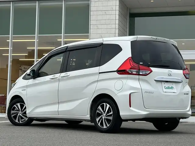 ホンダ フリード ハイブリット EX 兵庫県 2018(平30)年 5.2万km ホワイトオーキッドパール 純正9インチナビ/両側パワースライドドア/Bluetooth接続/フルセグTV/バックカメラ/追従有クルーズコントロール/ドライブレコーダー/純正フロアマット/純正アルミホイール/LEDヘッドライト/前席シートヒーター/スペアキー/スイッチスタート/ビルトインETC/ウォークスルー