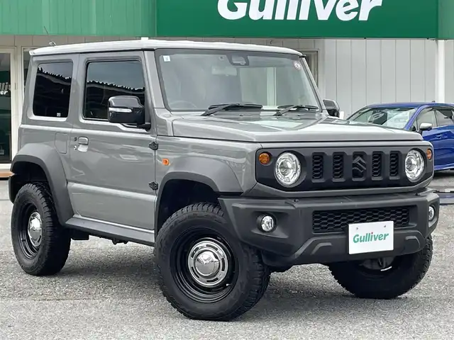 スズキ ジムニー シエラ JC 千葉県 2021(令3)年 3.1万km ミディアムグレー ワンオーナー/スズキセーフティーサポート/・デュアルセンサーブレーキサポート/・車線逸脱警報/・誤発進抑制機能/・標識認識機能/クルーズコントロール/社外ディスプレイオーディオ【PVH-9300DVSZS】/・CD/DVD/Bluetooth/バックカメラ/DEAN CROSS COUNTRY16インチアルミホイール/JAOSステップカバー/背面タイヤハードカバー/レザー調シートカバー/スマートキー/ヒルディセントコントロール/前席シートヒーター/純正LEDヘッドライト/フォグランプ/ビルトインETC2.0/カーテンエアバッグ/新車時保証書＆取扱説明書