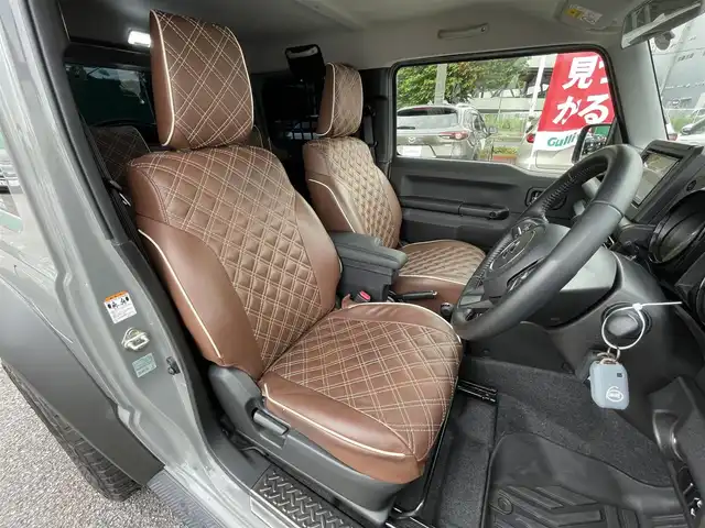 スズキ ジムニー シエラ JC 千葉県 2021(令3)年 3.1万km ミディアムグレー ワンオーナー/スズキセーフティーサポート/・デュアルセンサーブレーキサポート/・車線逸脱警報/・誤発進抑制機能/・標識認識機能/クルーズコントロール/社外ディスプレイオーディオ【PVH-9300DVSZS】/・CD/DVD/Bluetooth/バックカメラ/DEAN CROSS COUNTRY16インチアルミホイール/JAOSステップカバー/背面タイヤハードカバー/レザー調シートカバー/スマートキー/ヒルディセントコントロール/前席シートヒーター/純正LEDヘッドライト/フォグランプ/ビルトインETC2.0/カーテンエアバッグ/新車時保証書＆取扱説明書