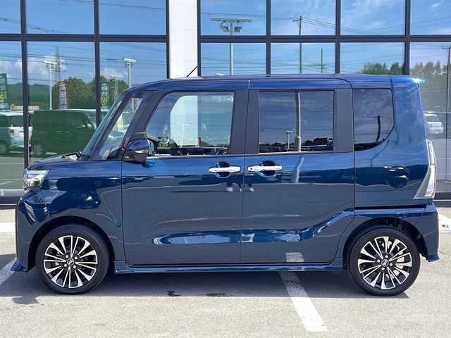 ダイハツ タント カスタム RS 道東・釧路十勝 2025(令7)年 0.8万km レーザーブルークリスタルシャイン ・4WD/・純正SDナビ/（iPod・FM・AM・BT・CD・DVD・フルセグ）/・バックカメラ/全方位カメラ/・両側パワースライドドア/・純正前方ドライブレコーダー/・ハーフレザーシート/・前席シートヒーター/・TRC/・リアパーキングセンサー/・衝突軽減システム/・車線逸脱警報/・横滑り防止/・LEDヘッドライト/・フォグライト/・オートマチックハイビーム/・オートブレーキホールド/・オートライト/・アイドリングストップ/・革巻きステアリング/・ステアリングスイッチ/・電格ウィンカーミラー/・スマートキー/・プッシュスタート