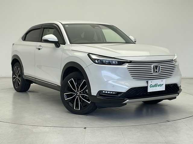 ホンダ ヴェゼル ハイブリッド e:HEV Z 千葉県 2021(令3)年 2.9万km プラチナホワイトパール ホンダセンシング/衝突軽減ブレーキ/レーンキープアシスト/レーダークルーズコントロール/アダプティブヘッドライト/クリアランスソナー/ブラインドスポットモニター/後退出庫サポート/踏み間違い防止/純正9インチメモリナビ(LXM-242ZFNi)/フルセグ/BT/USB/カープレイ/バックカメラ/ステアリングスイッチ/ステアリングヒーター/パドルシフト/純正ドライブレコーダー/ETC2.0/ワイヤレス充電/電動パーキングブレーキ/ハンズフリーアクセスパワーテールゲート/ハーフレザーシート/シートヒーター(D/N席)/スマートキー/スペアキー/プッシュスタート/LEDヘッドライト/オートライト