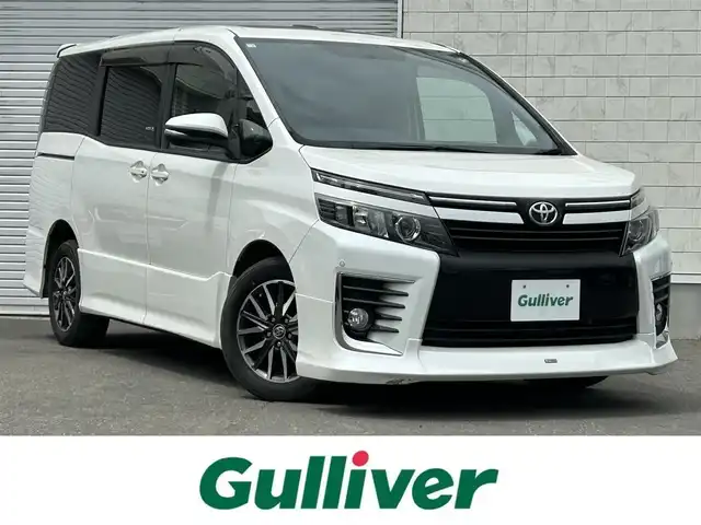 トヨタ ヴォクシー ZS 道東・釧路十勝 2014(平26)年 7.9万km ホワイトパールクリスタルシャイン 4WD/寒冷地仕様/モデリスタエアロ/サンルーフ/純正9インチナビ/(AM FM CD DVD BT フルセグTV)/バックカメラ/両側パワースライドドア/社外AW付冬タイヤ4本積込/コーナーセンサー/ビルトインETC/プッシュスタート/スマートキー/LEDヘッドライト/フォグランプ/革調シートカバー