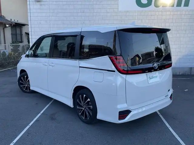 トヨタ ノア ハイブリッド S－Z 静岡県 2024(令6)年 0.1千km ホワイトパールクリスタルシャイン 純正ナビTV/（CD/DVD/BT）/バックカメラ/トヨタセーフティセンス/両側パワースライドドア/レーダークルーズコントロール/プリクラッシュセーフティ/レーンキープアシスト/横滑り防止装置/HDMI/ETC2.0/AC100V/ハーフレザーシート/前席シートヒーター/電動パーキングブレーキ/オートホールド/LEDヘッドライト/オートマチックハイビーム/前後型ドライブレコーダー/純正17インチアルミホイール/スマートキー/プッシュスタート/保証書