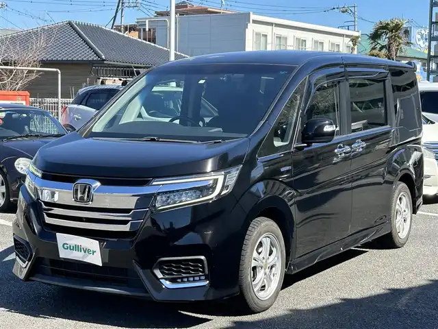 ホンダ ステップワゴン スパーダ ハイブリッド G ホンダセンシング 静岡県 2018(平30)年 14.7万km プレミアムスパークルブラックパール ワンオーナー/純正ナビ（FM/AM/CD/BT/HDMI/TV）/アラウンドビューモニター/ドライブレコーダー/ビルトインETC/クルーズコントロール/フリップダウンモニター/両側パワースライドドア/純正AW有り