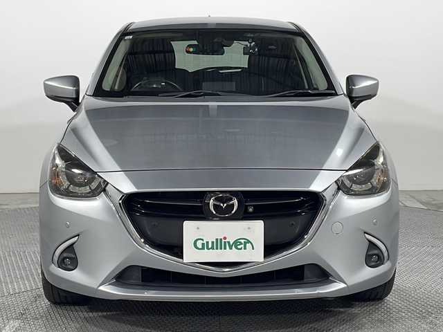 マツダ デミオ XD ツーリング 広島県 2017(平29)年 4.6万km ソニックシルバーM 禁煙車/純正ナビ/全周囲カメラ/シートヒーター/ヘッドアップディスプレイ/レーダークルーズコントロール/ＥＴＣ/前後ドラレコ/パドルシフト/コーナーセンサー/オートマチックハイビーム/レーンキープ/衝突被害軽減システム/エアバッグ(運転席/助手席/サイド/カーテン)/純正16インチアルミホイール(185/60/R16)