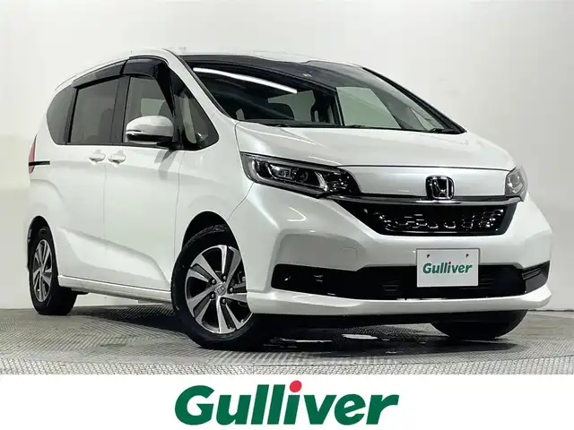 ホンダ フリード G ホンダセンシング 大阪府 2022(令4)年 1.5万km プラチナホワイトパール 純正ナビ バックカメラ ハーフレザー シートヒーター レーダークルコン 衝突軽減ブレーキ レーンアシスト 両側パワースライドドア オートライト アイドリングストップ ETC