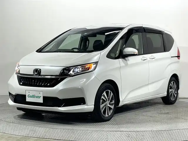 ホンダ フリード G ホンダセンシング 大阪府 2022(令4)年 1.5万km プラチナホワイトパール 純正ナビ バックカメラ ハーフレザー シートヒーター レーダークルコン 衝突軽減ブレーキ レーンアシスト 両側パワースライドドア オートライト アイドリングストップ ETC