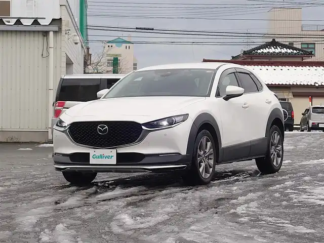 マツダ ＣＸ－３０ XD Lパッケージ 山形県 2020(令2)年 7万km スノーフレイクホワイトパールマイカ 4WD/軽油/衝突被害軽減システム/BOSEサウンド/純正メモリナビ/　　【CD DVD BT フルセグ USB AUX】/全周囲カメラ/電動リアゲート/レーダークルーズコントロール/LEDオートヘッドライト/レザーシート/パワーシート/シートヒーター/純正18インチアルミホイール/コーナーセンサー/アイドリングストップ/ステアリングスイッチ/パドルシフト/ターボ/電動格納ウィンカーミラー/スマートキー×2/ETC