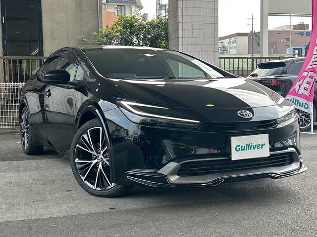 トヨタ プリウス Z 京都府 2023(令5)年 1万km アティチュードブラックマイカ 純正12.3インチディスプレイナビ/フルセグテレビ/アラウンドビューモニター/Miracast/ワイヤレス充電/Bluetooth/デジタルインナーミラー/メモリーパワーシート/シートヒーター＆ベンチレーション/ステアリングヒーター/トヨタセーフティーセンス/アドバンスドパーク/ブラインドスポットモニター/クリアランスソナー/プリクラシュセーフティー/リヤクロストラフィックアラート/ロードサインアシスト/レーダークルーズコントロール/プロアクティブドライビングアシスト/ワンオーナー/禁煙車/ビルトインETC2.0/ウィンカーミラー/電動格納ミラー
