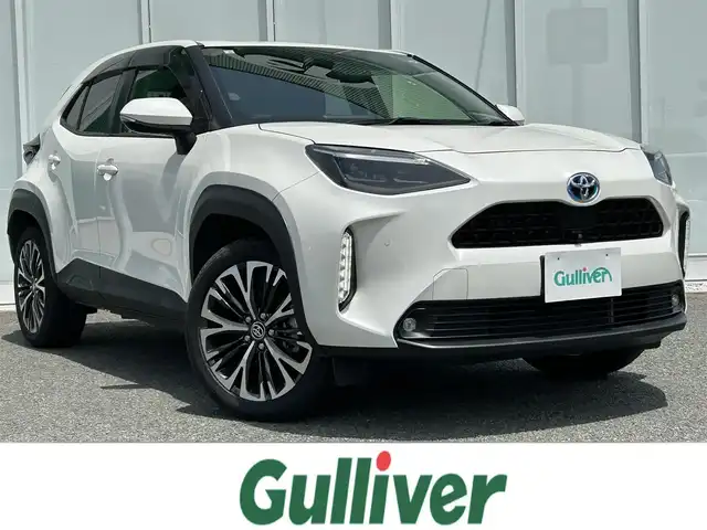 トヨタ ヤリスクロス ハイブリッド Z 福岡県 2020(令2)年 8.6万km ホワイトパールクリスタルシャイン ・純正ディスプレイオーディオ（Bluetooth・Miracast）/・全方位カメラ/・ブラインドスポットモニター/・ETC/・ドライブレコーダー/・D席パワーシート/・D/N席シートヒーター/・ステアリングスイッチ/・クルーズコントロール（追従走行あり）/・ブレーキホールド機能/・オートマチックハイビーム/・レーンキープアシスト/・横滑り防止装置/・純正フルエアロパーツ/・純正LEDヘッドライト/・フォグランプ/・オート電動格納ミラー/・トップテザー/・１００V充電