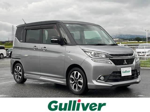 三菱 デリカＤ：２ カスタムHV　MV 富山県 2017(平29)年 1.5万km シルバー ワンオーナー/純正メモリナビ/　（BlueTooth/CD/DVD/AM/FM/フルセグTV） /純正アルミホイール/両側パワースライドドア/衝突被害軽減システム/車線逸脱警告機能/横滑り防止機能/フルフラットシート/クルーズコントロール/フロントLEDライト＋フォグランプ/保証書/取扱説明書/記録簿