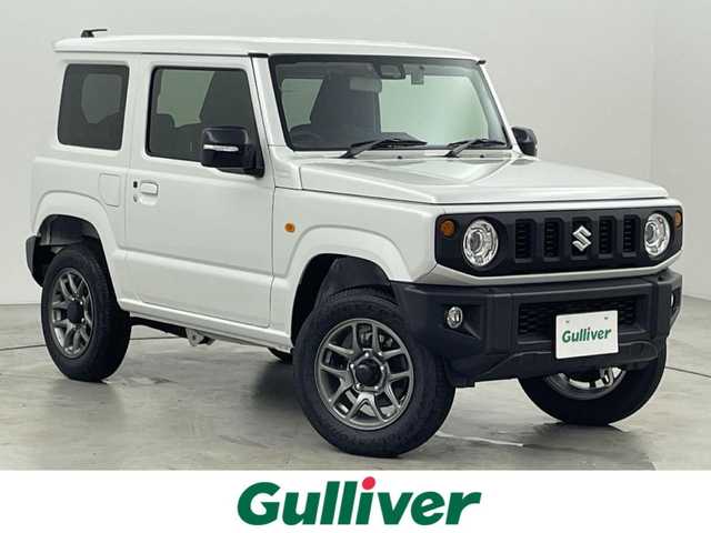 スズキ ジムニー XC 福岡県 2024(令6)年 0.1万km未満 ピュアホワイトP 登録済未使用車　/社外ナビ（フルセグＴＶ）　/ＥＴＣ　/前方ドライブレコーダー　/クルーズコントロール　/コーナーセンサー　/衝突被害軽減ブレーキ　/レーンキープ　/ヒルディセントコントロール　/シートヒーター　/ＬＥＤ